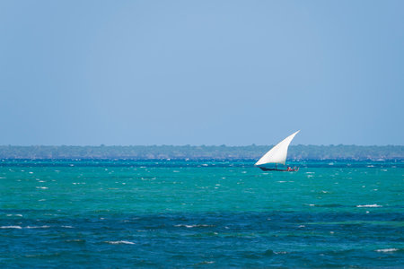 Dhow boat sails in the ocean, summer concept, copy-space, Zanzibar in Tanzania.の写真素材