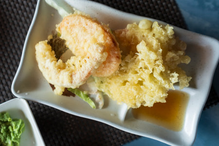 Top view of prepared Japanese vegetable tempura recipe with ginger ponzu sauce.の写真素材
