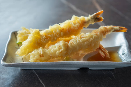 Close up view of prepared Japanese prawns tempura recipe with ginger ponzu sauce.の写真素材