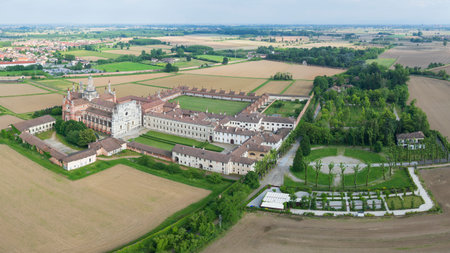 Aerial shot of Certosa di Pavia cathedral a historical monumental complex that includes a monastery and a sanctuary. Pavia, Italy.の写真素材