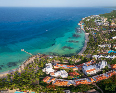 Drone view of Caribbean sea, sandy beach, pier, and luxury resort at sunny day ,coastline of Bayahibe beach, Dominican Republic.の写真素材
