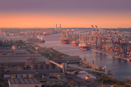 Aerial view of industrial and port area of Ravenna,production district is made up of a chemical and petrochemical pole, thermoelectric and metallurgical plants at sunsetの写真素材
