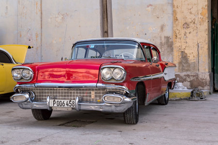 Red american car parked in Havana, Cubaのeditorial素材