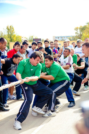 ZARAFSHAN, UZBEKISTAN - October 30: Traditional tug of war competitions dedicated to the professional holiday のeditorial素材