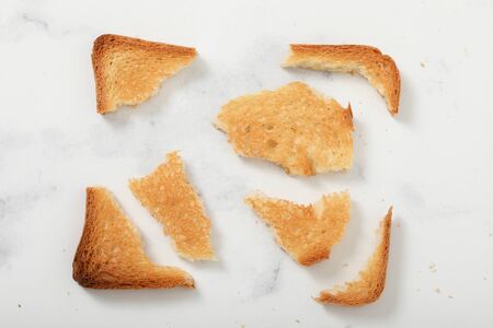 Toast biscuits over white background snack lunchの写真素材