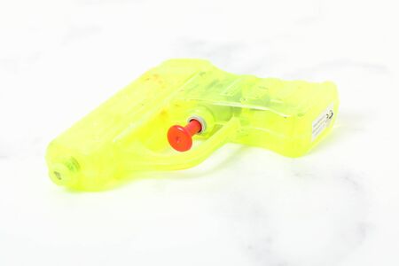 colored water pistol green on white background isolated