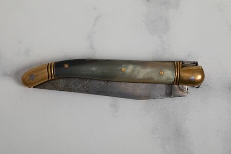 Details of laguiole knife on white marble backgroundの写真素材