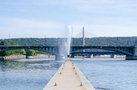 A big fountain in the back of the Boverie park in front of the FragnÃ©e bridge in LiÃ¨ge, Belgiumのeditorial素材