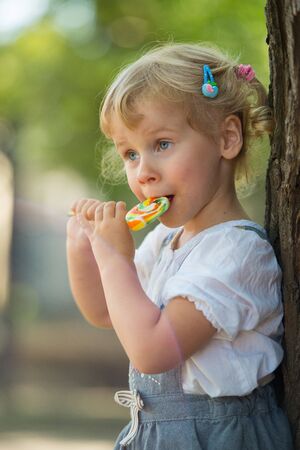 Girl with a lollipopの写真素材