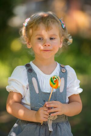 Girl with a lollipopの写真素材