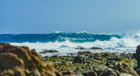 The El Confital wave is a powerful slab which breaks on a very shallow reef. The wave is pretty famous under boogyboarders.の写真素材