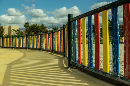 The colorful fence of a playground on tenerife.の写真素材