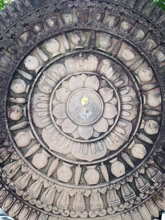 Wheel symbol sandstone sculpture
