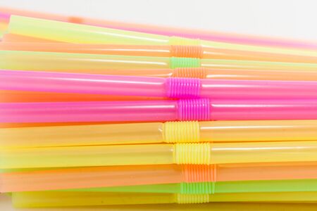 Colorful plastic straws used for drinking soft drinks, fresh juices, smoothies which are using in hotels and restaurants.の写真素材