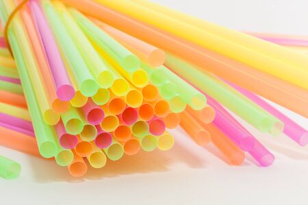 Colorful plastic straws used for drinking soft drinks, fresh juices, smoothies which are using in hotels and restaurants.の写真素材
