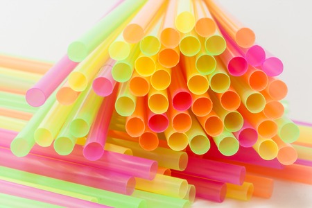 Colorful plastic straws used for drinking soft drinks, fresh juices, smoothies which are using in hotels and restaurants.の写真素材