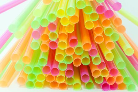 Colorful plastic straws used for drinking soft drinks, fresh juices, smoothies which are using in hotels and restaurants.の写真素材