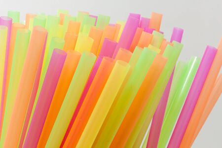 Colorful plastic straws used for drinking soft drinks, fresh juices, smoothies which are using in hotels and restaurants.の写真素材