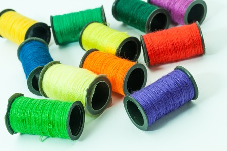 Collection of Colorful bobbin threads lying using for embroidery worksの写真素材