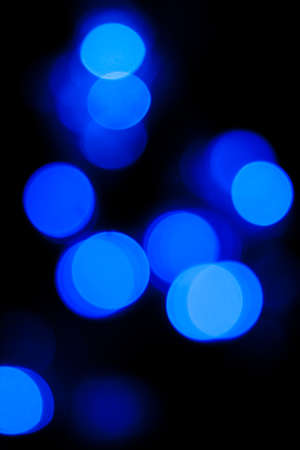 Blurred spots of blue lights bokeh for abstract color backgroundの写真素材