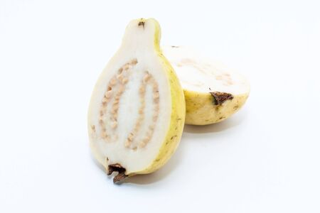 Guava fruit cut into two pieces on white backgroundの写真素材
