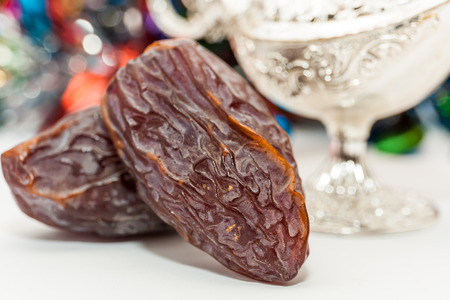 Date fruits and silver alaadin's lamp. Ramadan Eid conceptの写真素材