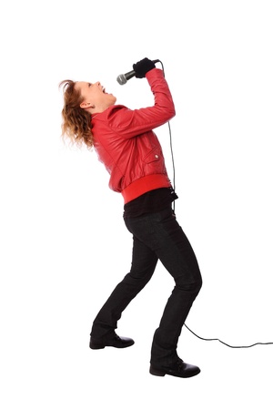 Cool looking rocker chic wearing a red leather jacket, screaming in a microphone  White background の写真素材