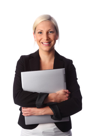Attractive business woman holding a computer wearing a black suit  White background の写真素材