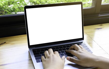 Computer mockup white background on desk. Laptop with blank screen.