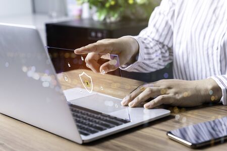 Laptop Computer with Data protection, Cyber security, information safety and encryption concept. internet technology and business concept, Mockup with copy space.の写真素材