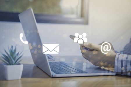 Contact us or Customer support hotline people connect. Businessman using a laptop with the (email,...