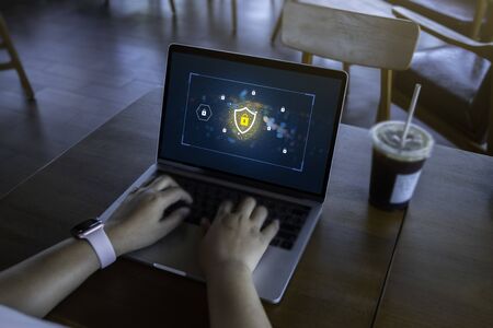 Businesswoman working on Laptop Computer with data protection, Cyber security, information safety...