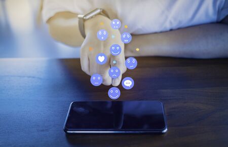 Person using a social media marketing concept on mobile phone with notification icons of like,...
