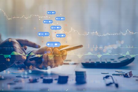 Double exposure of businessman using a social media marketing concept with notification icons with...