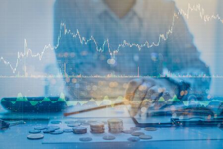 Double exposure of businessman working with candlestick graph chart with indicator and...