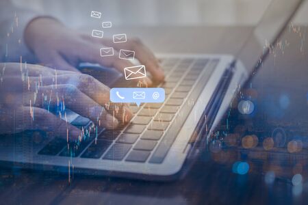 Double exposure of businessman using laptop with contact us or customer support hotline people...