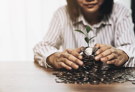 Person are holding a momey glass with save money for the future concept, saving money concept and finance accounting.の写真素材