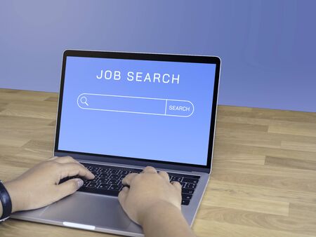 Business woman's hands with Laptop computer are looking for a new job online, business concept, Laptop mockupの写真素材