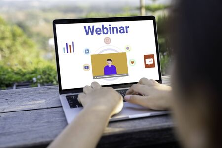 Person using a laptop computer for online training webinars. E-learning browsing connection and...