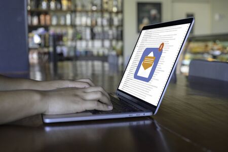 Person using a laptop computer with email communication connection message online and chat on social...