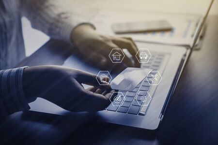 Businesswoman hands using laptop for financial data analyzing counting with saving money concept for...