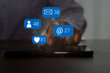 Woman hand using smartphone with social media concept.の写真素材