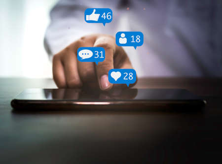 Woman hand using smartphone with social media concept.
