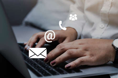 Contact us or Customer support hotline people connect. Businessman using a laptop computer with the...
