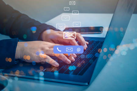 Contact us or Customer support hotline people connect. Businessman using a laptop computer with the...