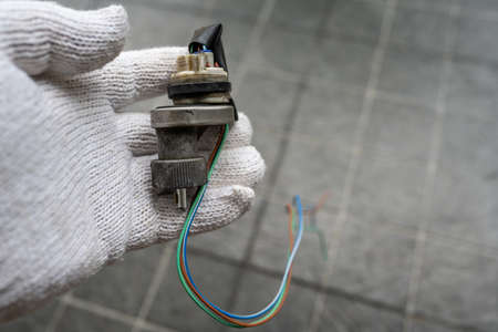 Mechanic holding a Speed Sensor for car.の写真素材