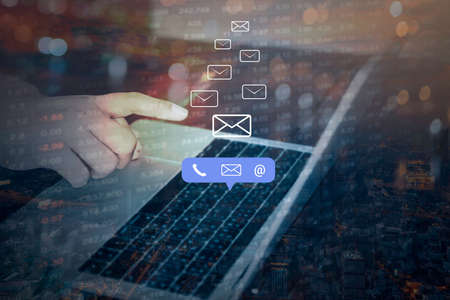 Double exposure of Contact us or Customer support hotline people connect. Businessman using a laptop...
