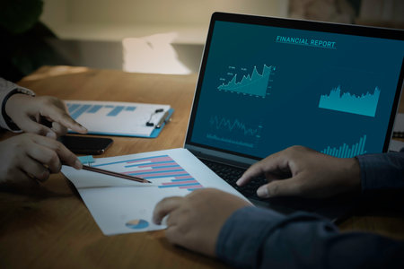 Businessman and team work using laptop with analyzing forex trading graph financial data. business finance technology and investment concept. Stock Market Investments funds Business finance background.の写真素材