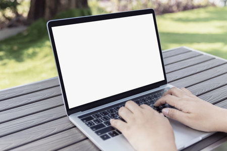 Mockup blank white screen laptop computer on white top table with copy space.の写真素材