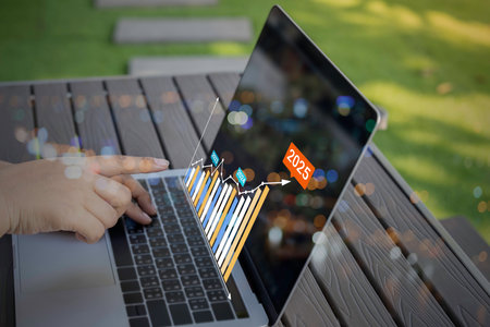 Businessman using laptop with analyzing forex trading graph financial data. business finance technology and investment concept. Stock Market Investments funds Business finance background.の写真素材